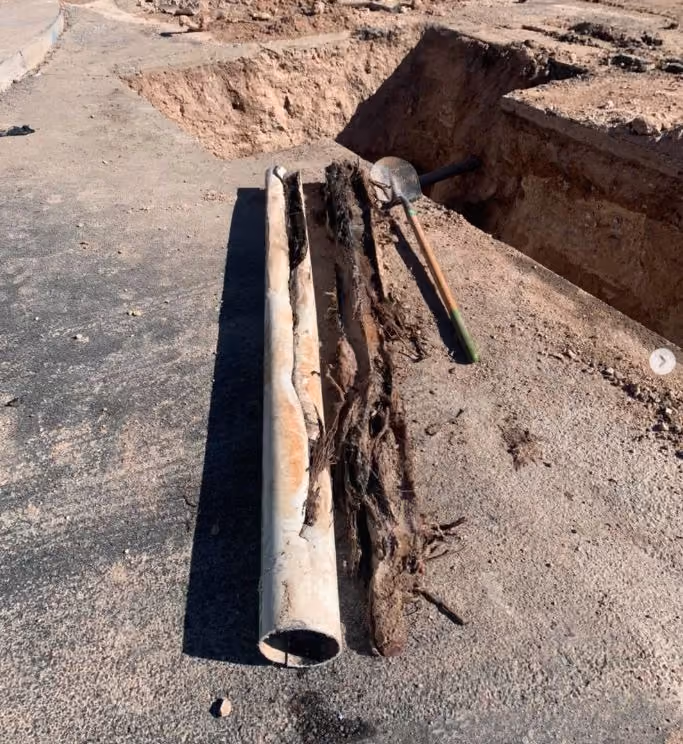Pipe repair services in Tucson AZ - damaged and corroded metal pipes exposed in ground excavation requiring professional replacement