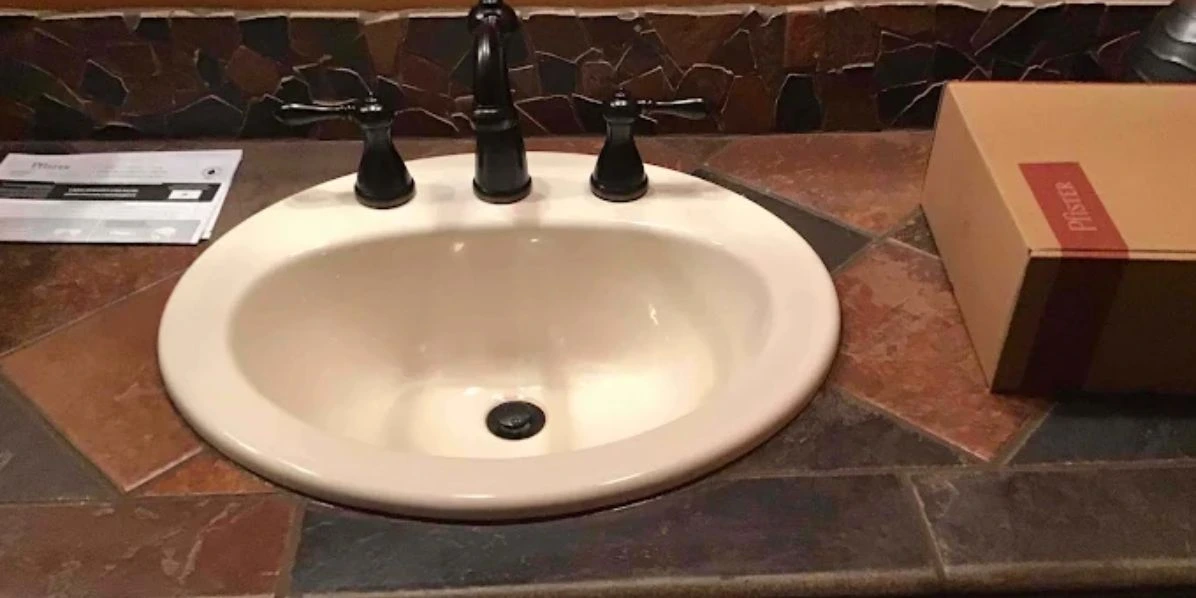 Faucet Installation Services in Tucson, AZ – bathroom sink with black faucet.