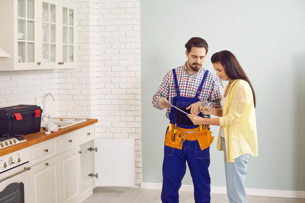 a person interviewing a plumber