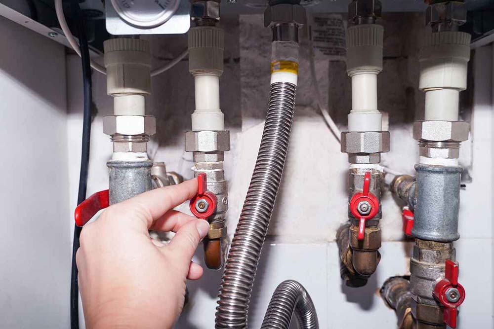 technician inspecting a gas line