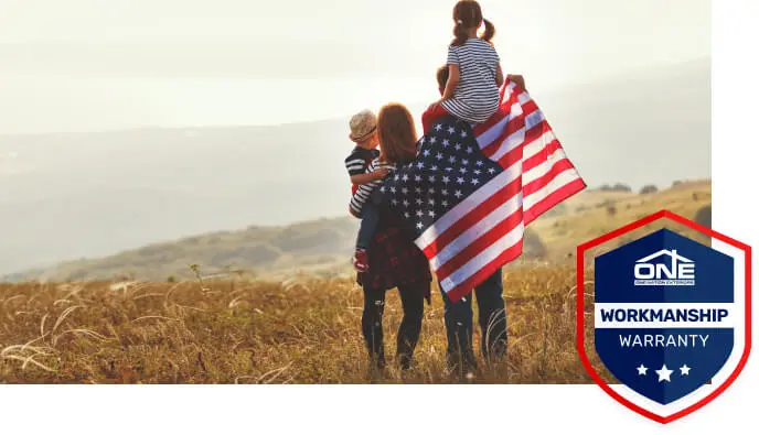 Family with American flag — One Nation Exteriors workmanship warranty