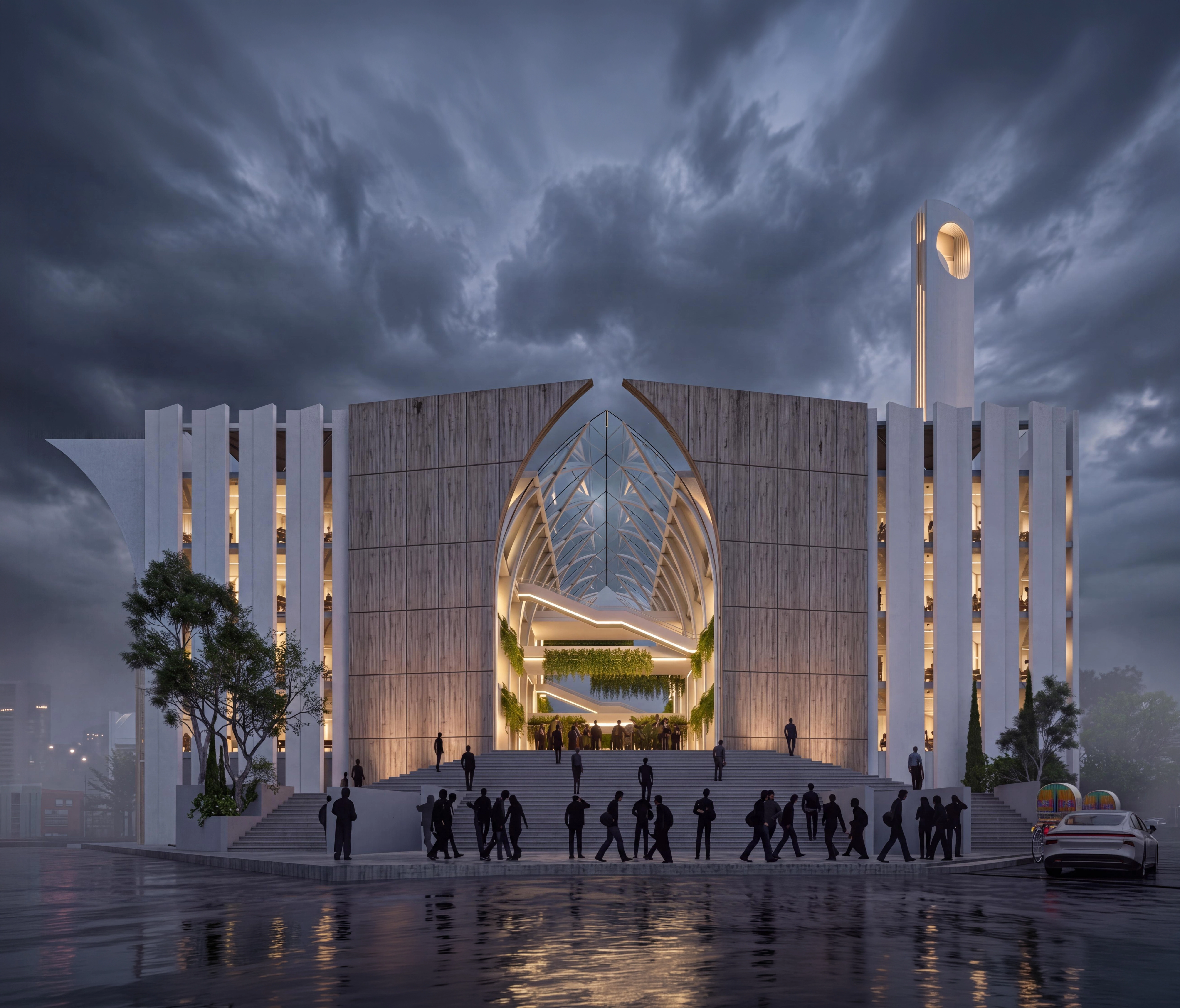 Modern building with a large arched glass roof, lit stairs, and silhouettes of people outside at dusk.