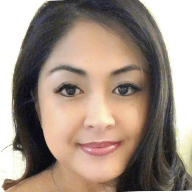 Portrait of a woman with dark hair, light makeup, and neutral expression against white background
