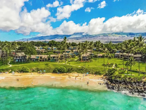 Aerial of the Wailea Elua villas above Ulua Beach, with Haleakalā behind