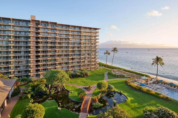 Aston at The Whaler tower, gardens and pool on Kāʻanapali Beach at golden hour