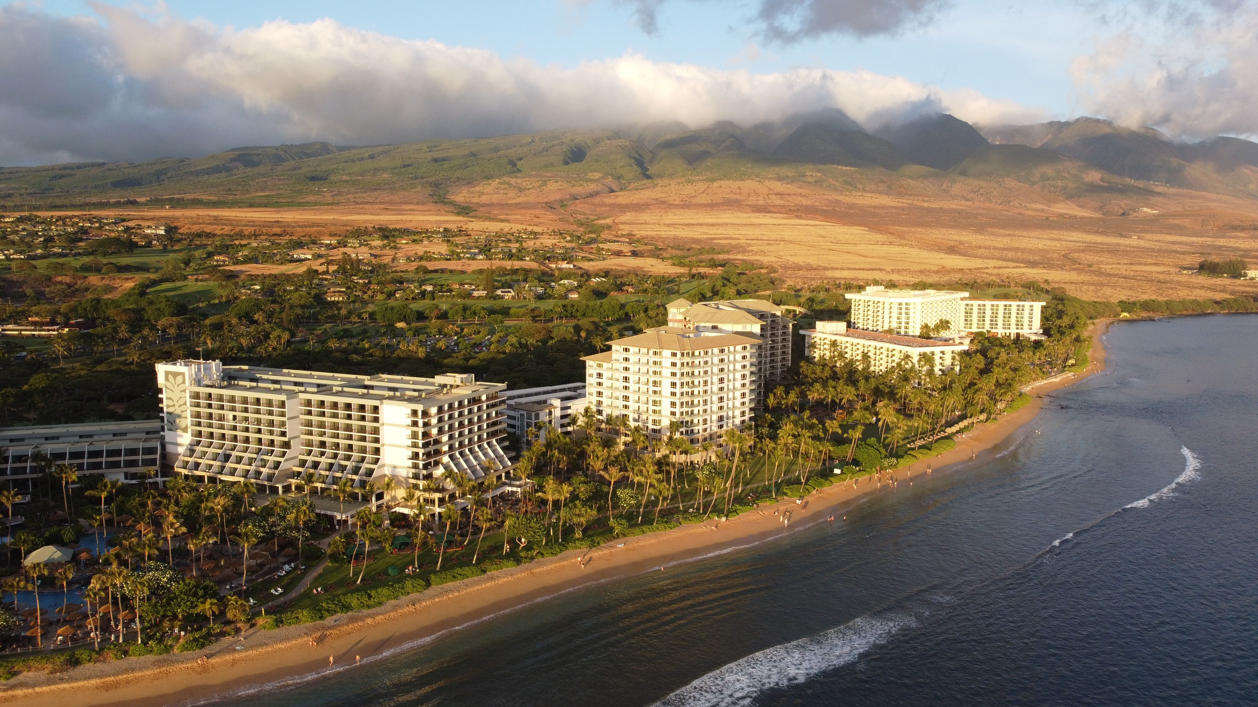 Kaanapali from the air, the resort corridor along a long curve of beach