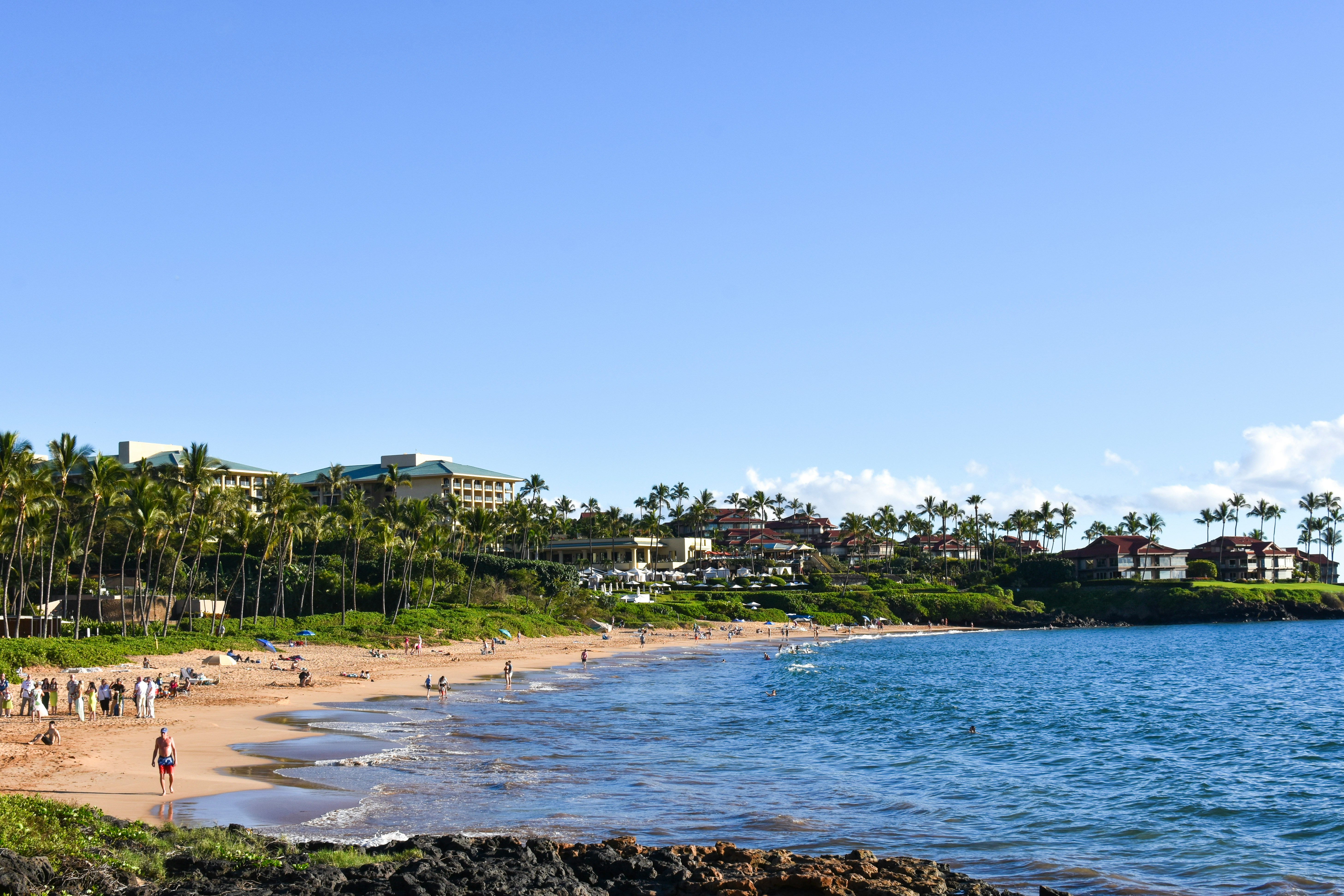 Wailea Beach with umbrellas on the sand and calm water beyond
