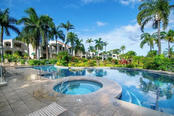 Pool and hot tub at Palms at Wailea with the villa buildings behind
