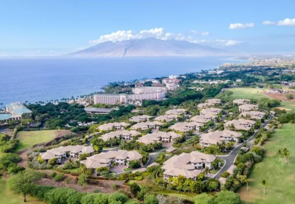 Aerial of the Hōʻolei villas on the Wailea hillside, with the ocean and West Maui mountains behind
