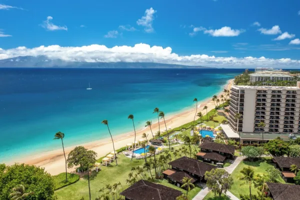 Royal Lahaina tower and bungalows above Kāʻanapali Beach, with Molokaʻi behind