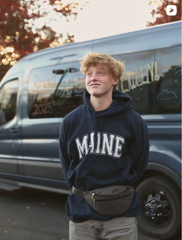 Teen by the road trip van