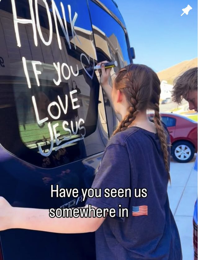 Kids painting the van windows