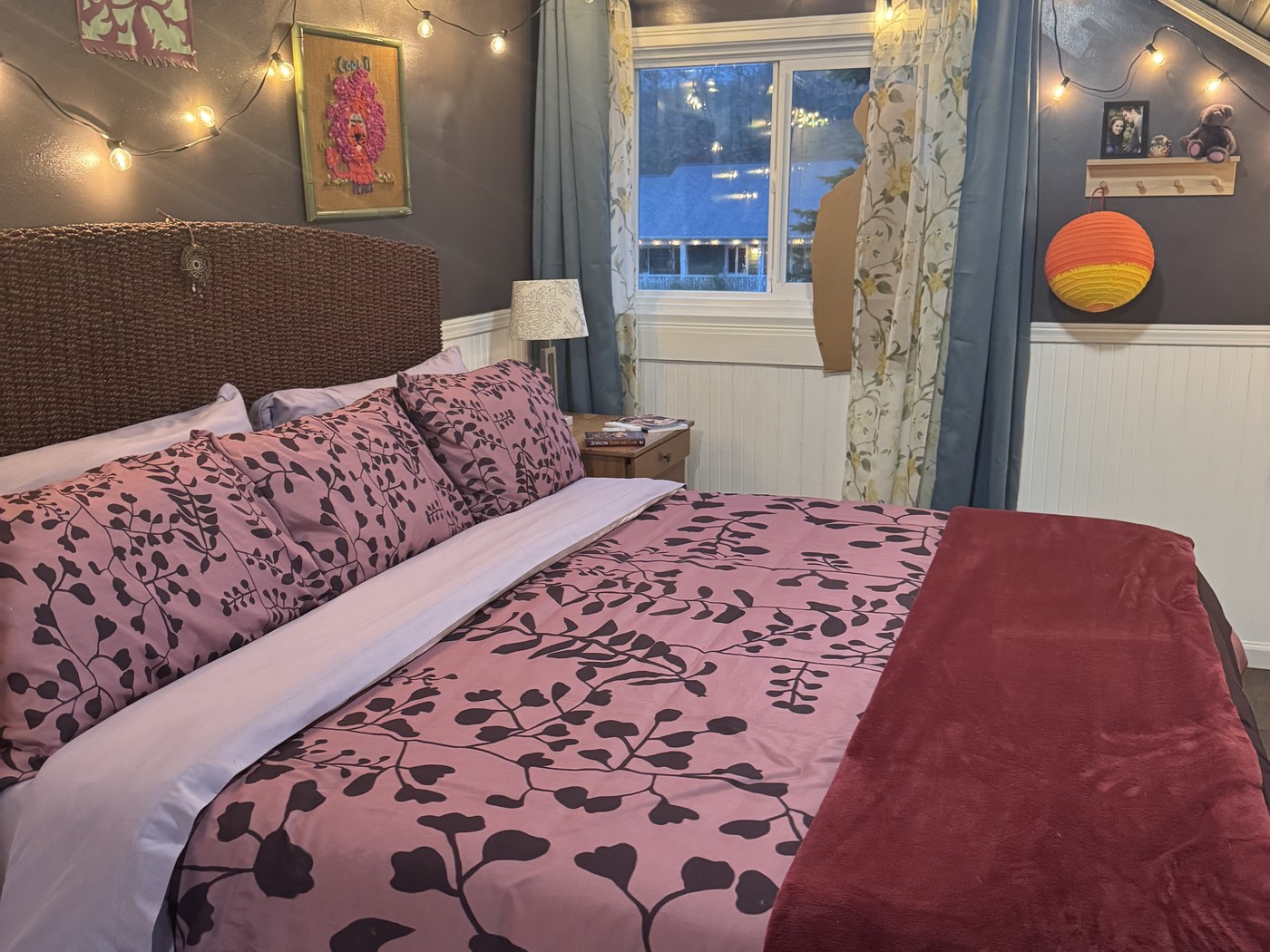 Bella's bed with pink and purple floral bedding