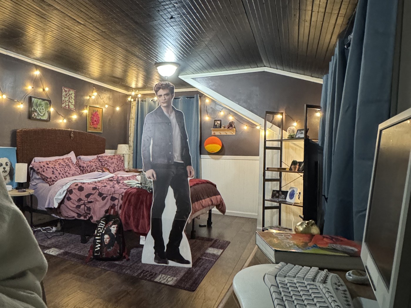 Bella's attic bedroom with string lights and a slanted ceiling