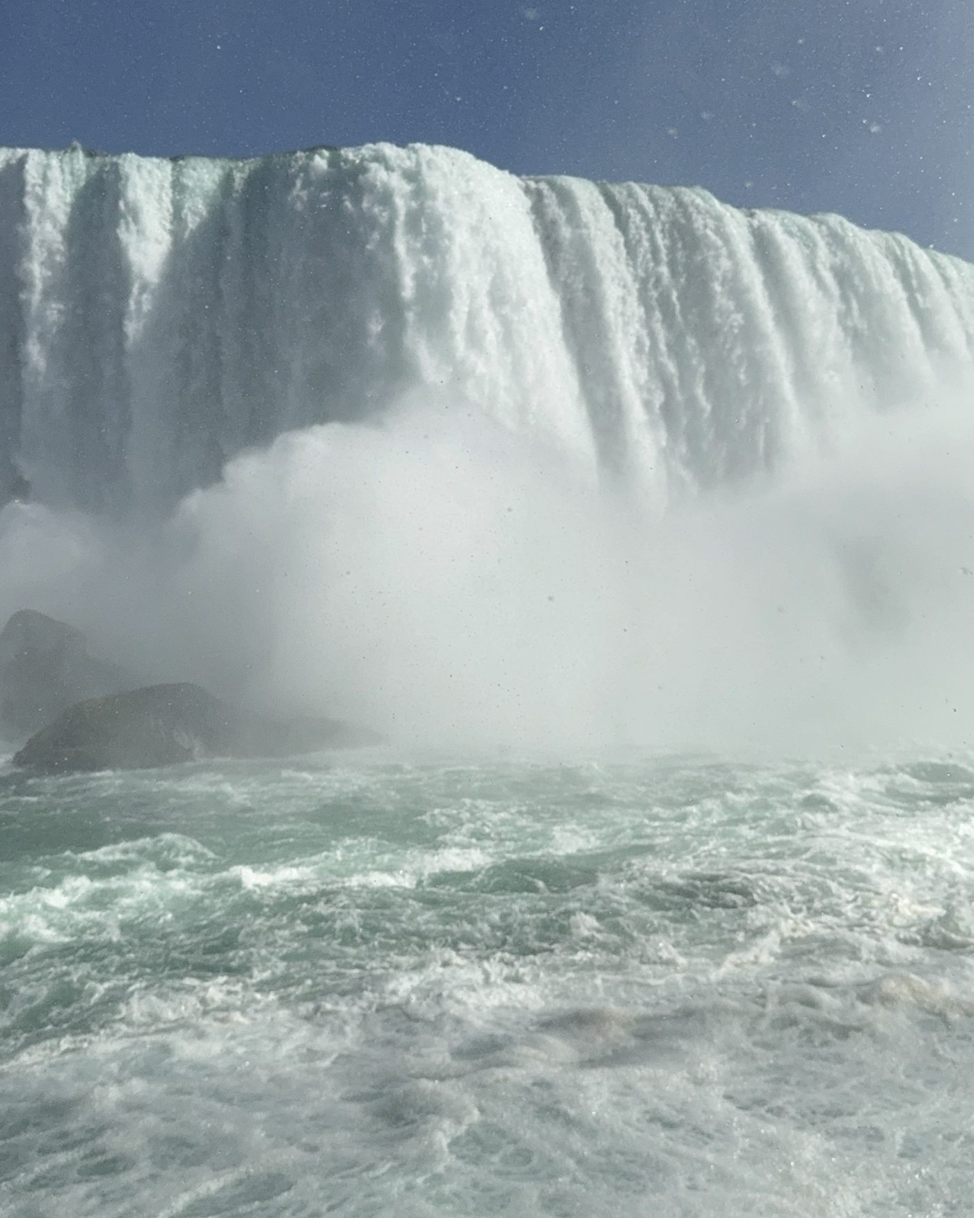 Niagara Falls up close with the mist and green water