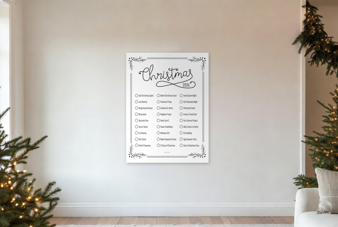 Christmas Holly bucket list print hanging in a living room