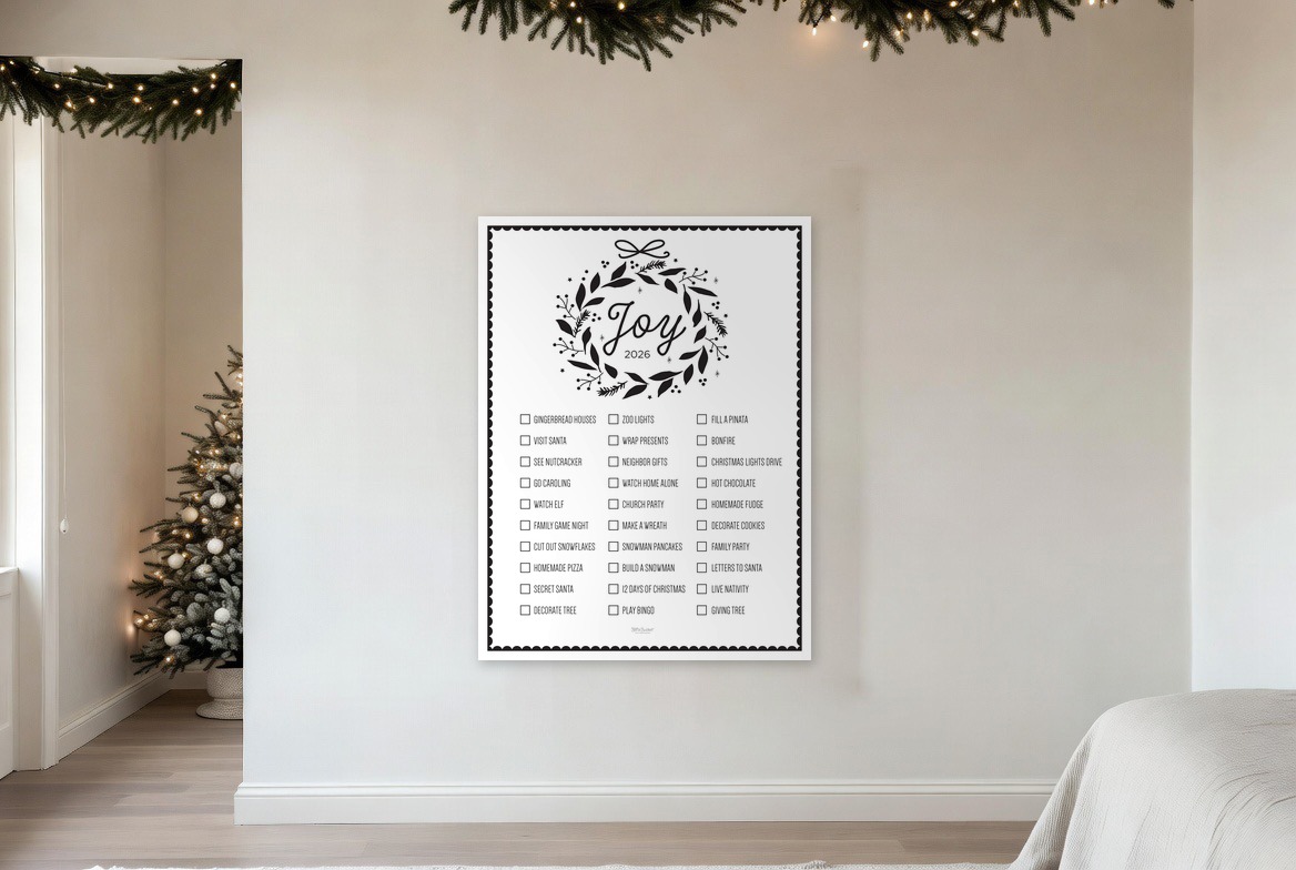 Joy bucket list print hanging in a living room