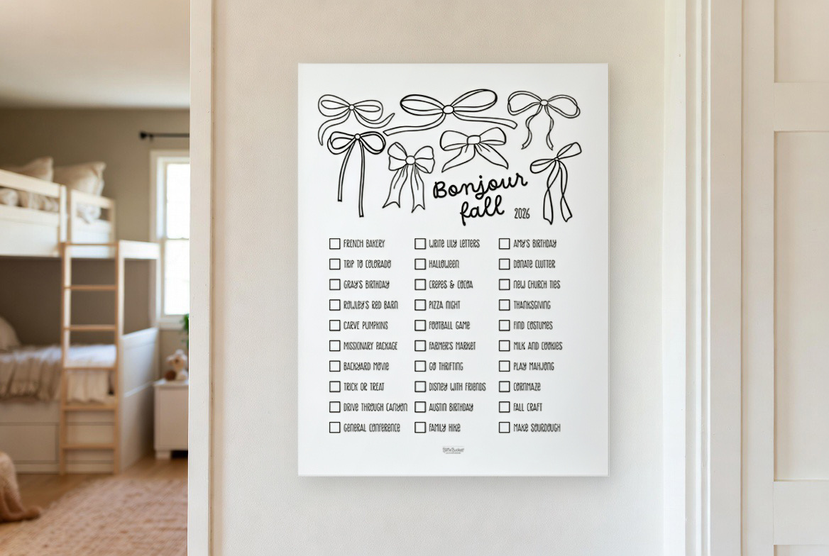 Bonjour Fall bucket list print hanging in a kids room