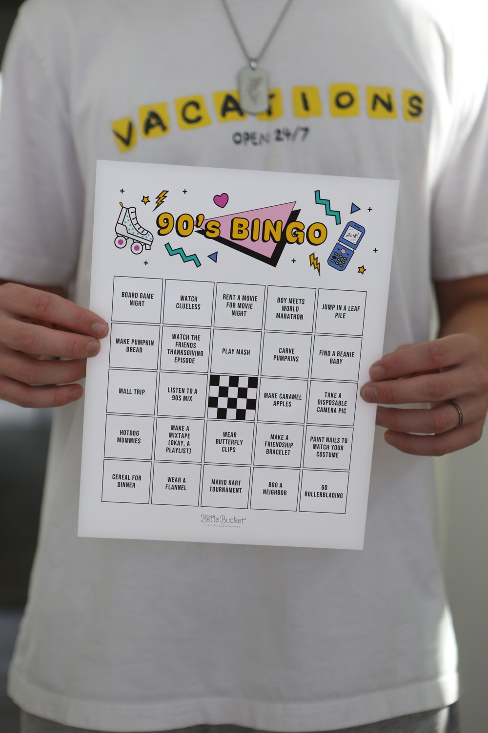 The 90s bingo card, printed and held up