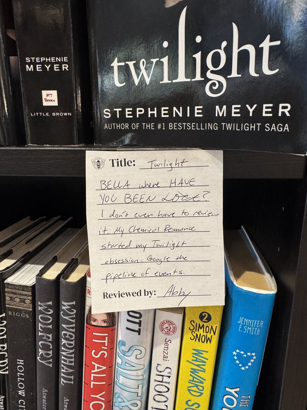 A staff review card for Twilight tucked into the shelf at Honeybee Books