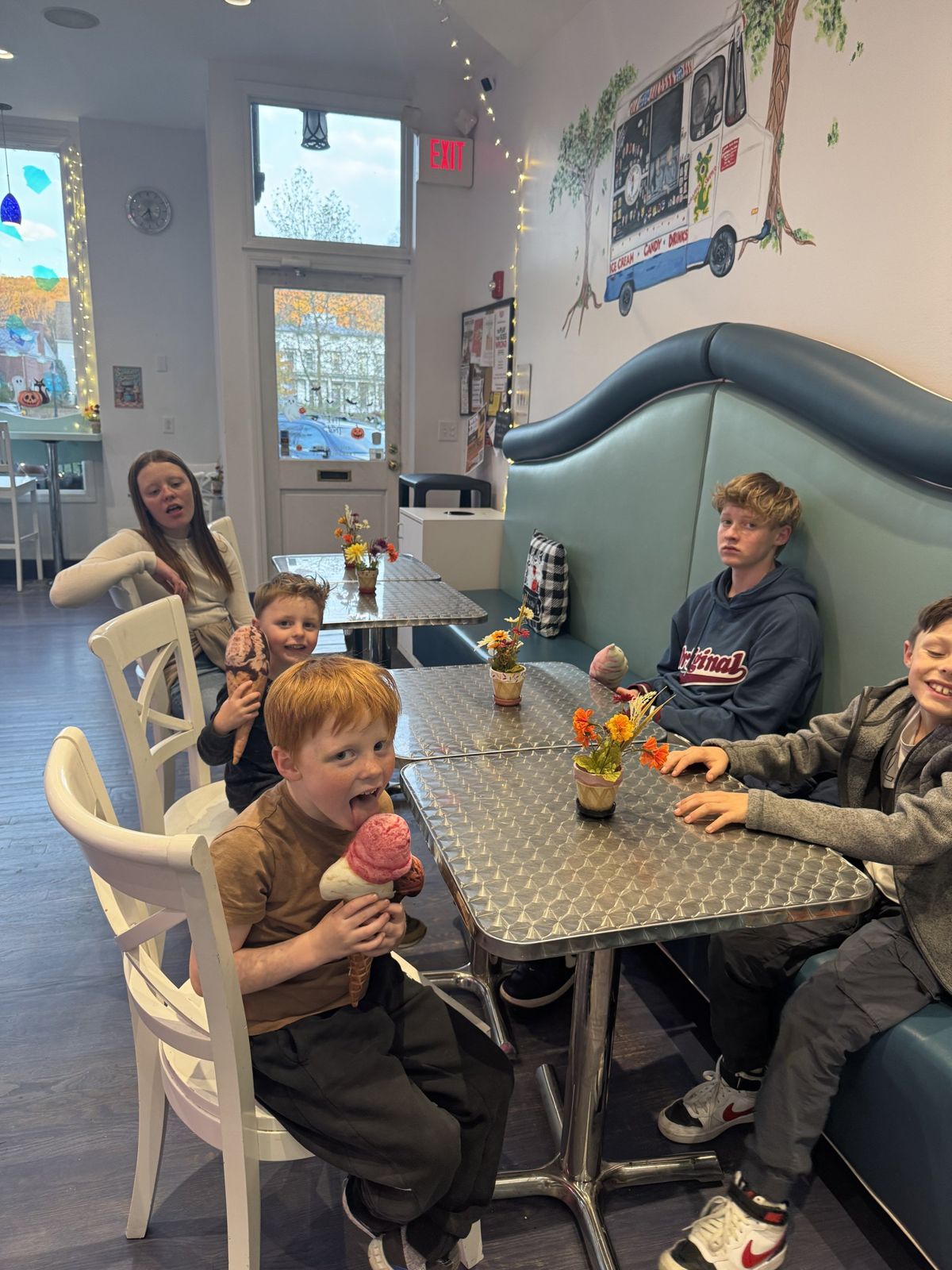 My kids in a booth with hot cocoa in New Milford