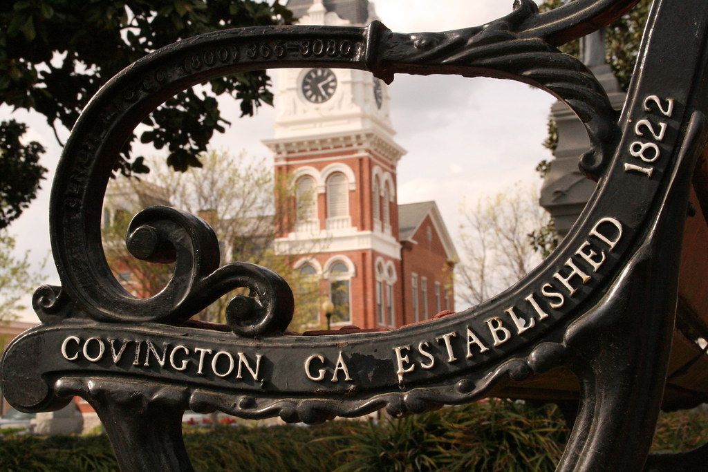A Covington GA Established 1822 bench framing the courthouse