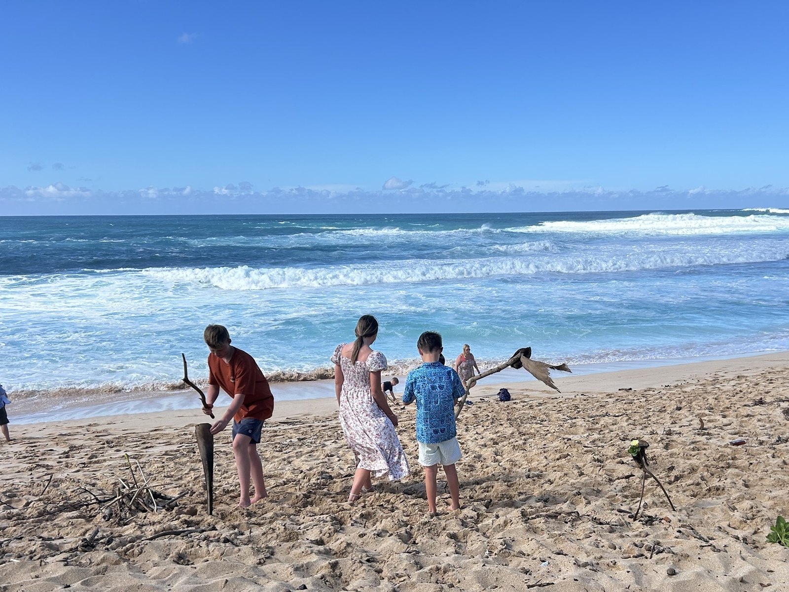 Three of our kids down by the water in Hawaii