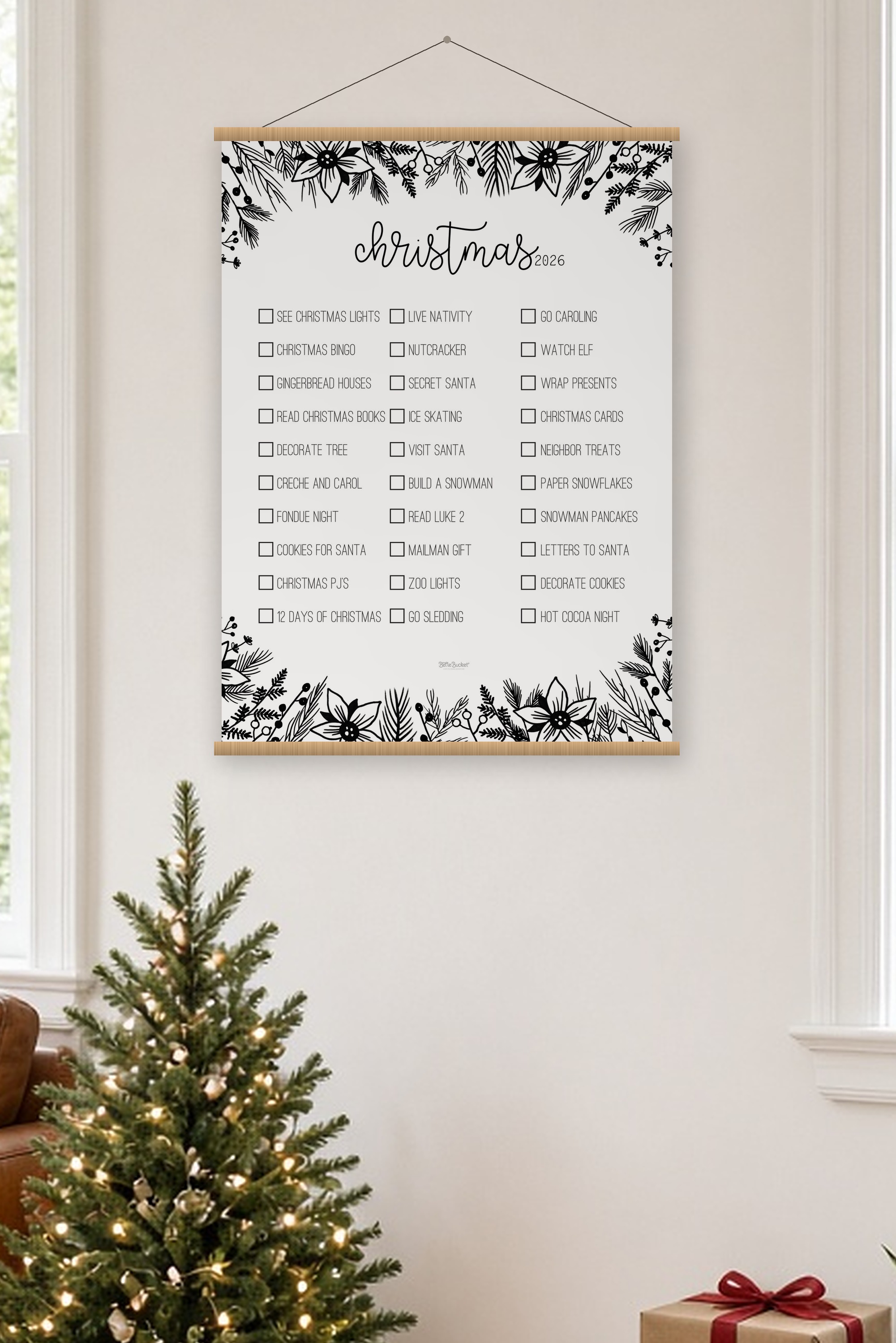 Christmas Pine bucket list poster, 36 by 48 inches, hanging on oak rails above a small lit Christmas tree in a cozy living room