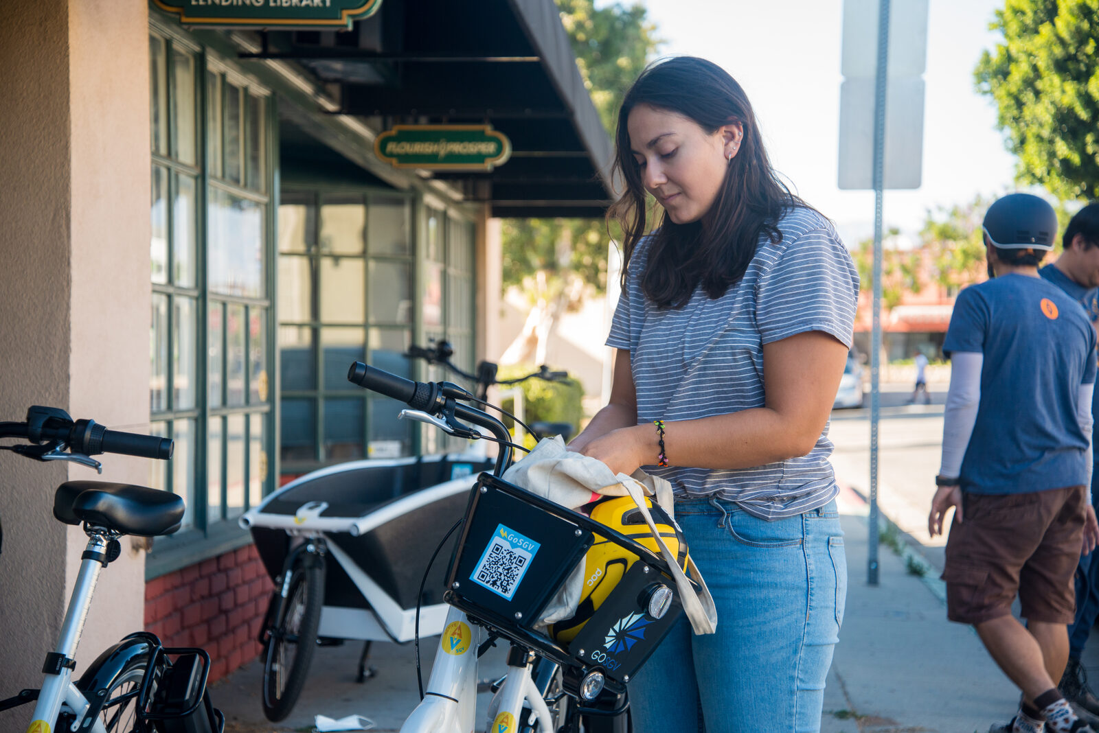 Member performing maintenance on GoSGV e-bike