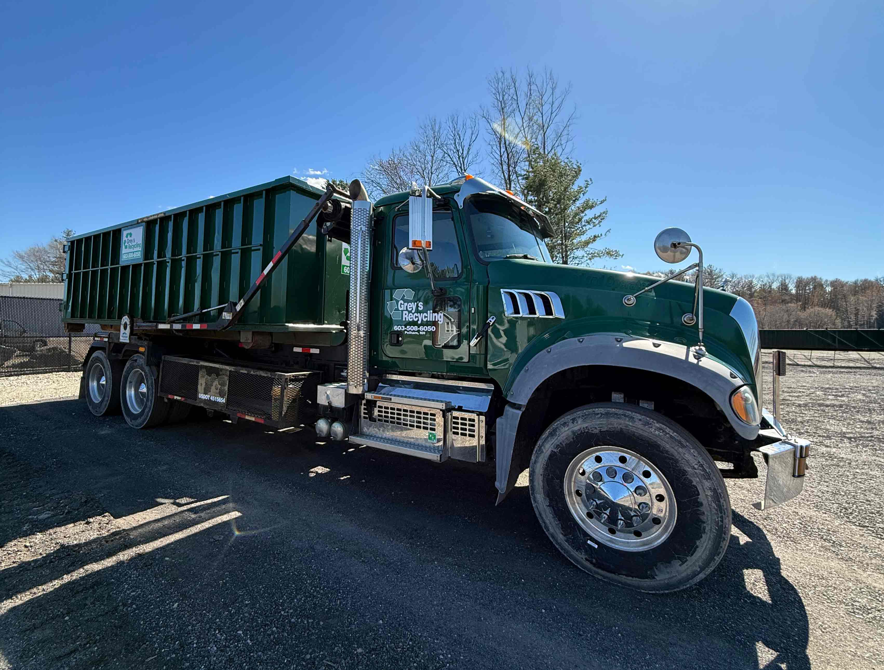Grey’s Recycling roll-off truck and dumpster