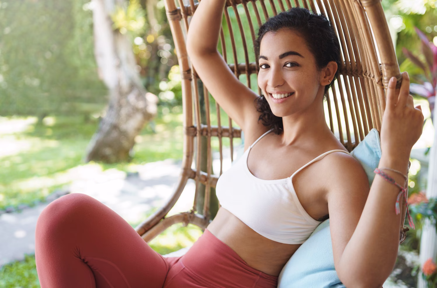 Smiling woman relaxing outdoors during a medical weight loss program