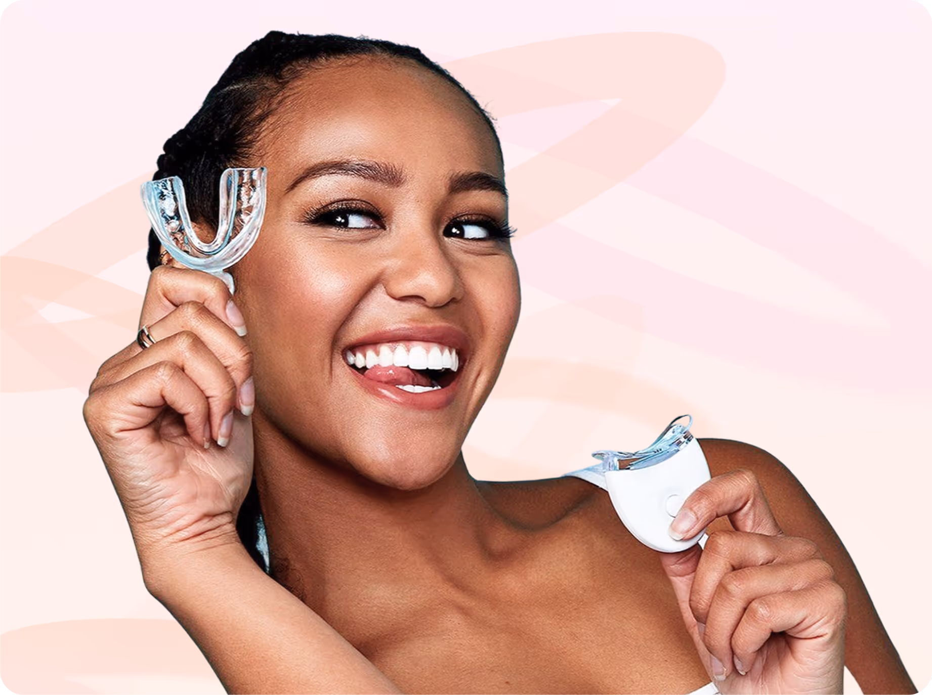 Smiling woman holding clear dental aligner in one hand and its white case in the other.