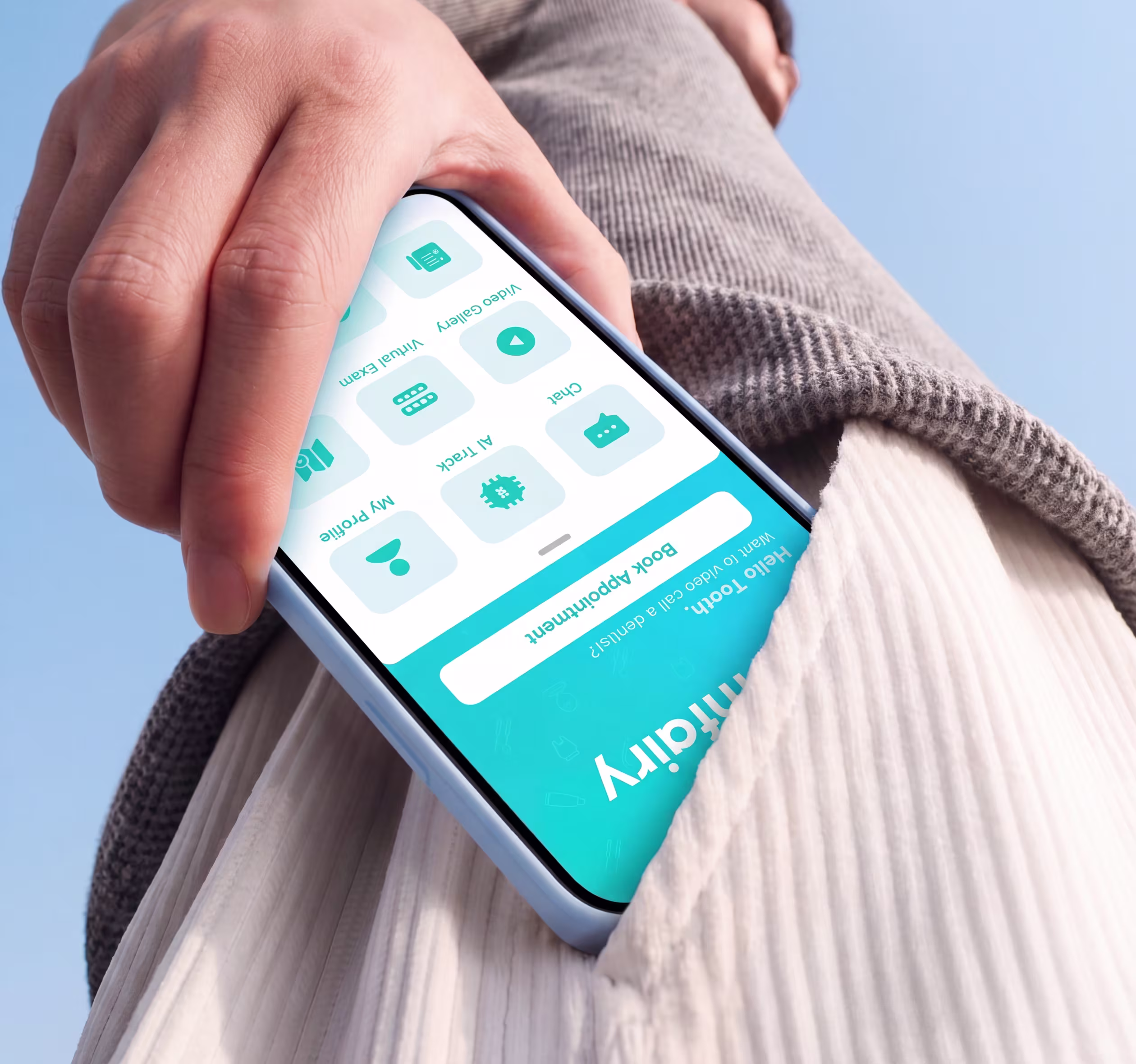 Hand holding a smartphone with a blue app interface, partially inside a white pocket against a blue sky.