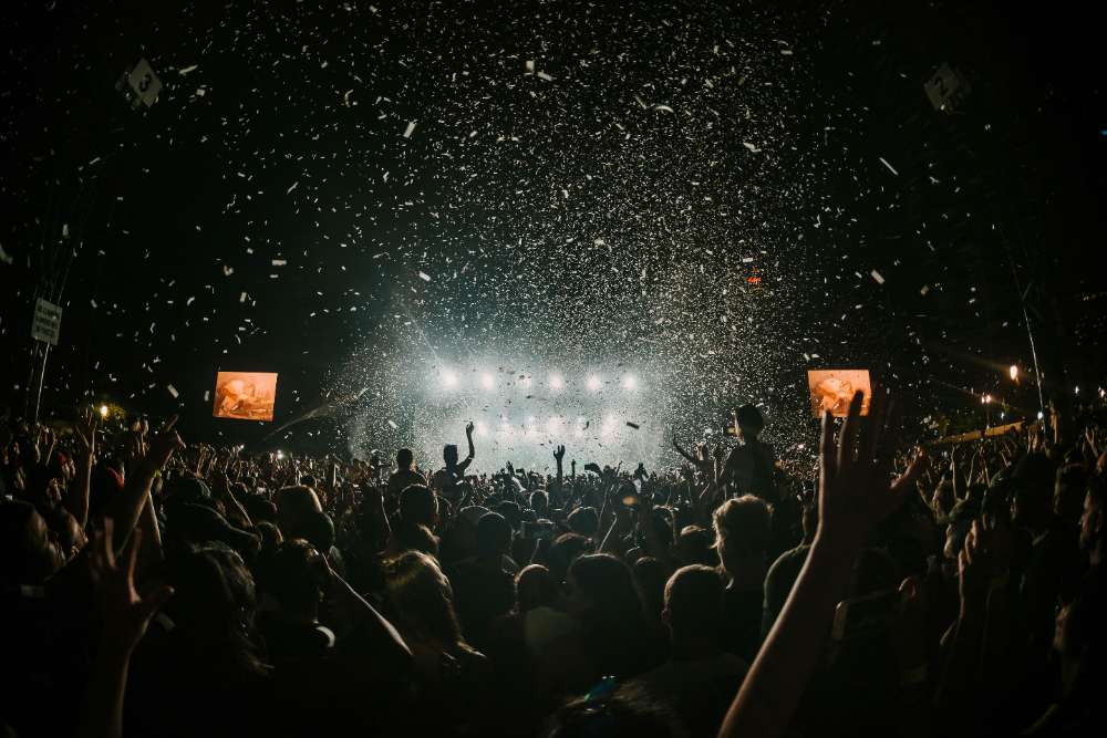 Concert at night, lights and confetti
