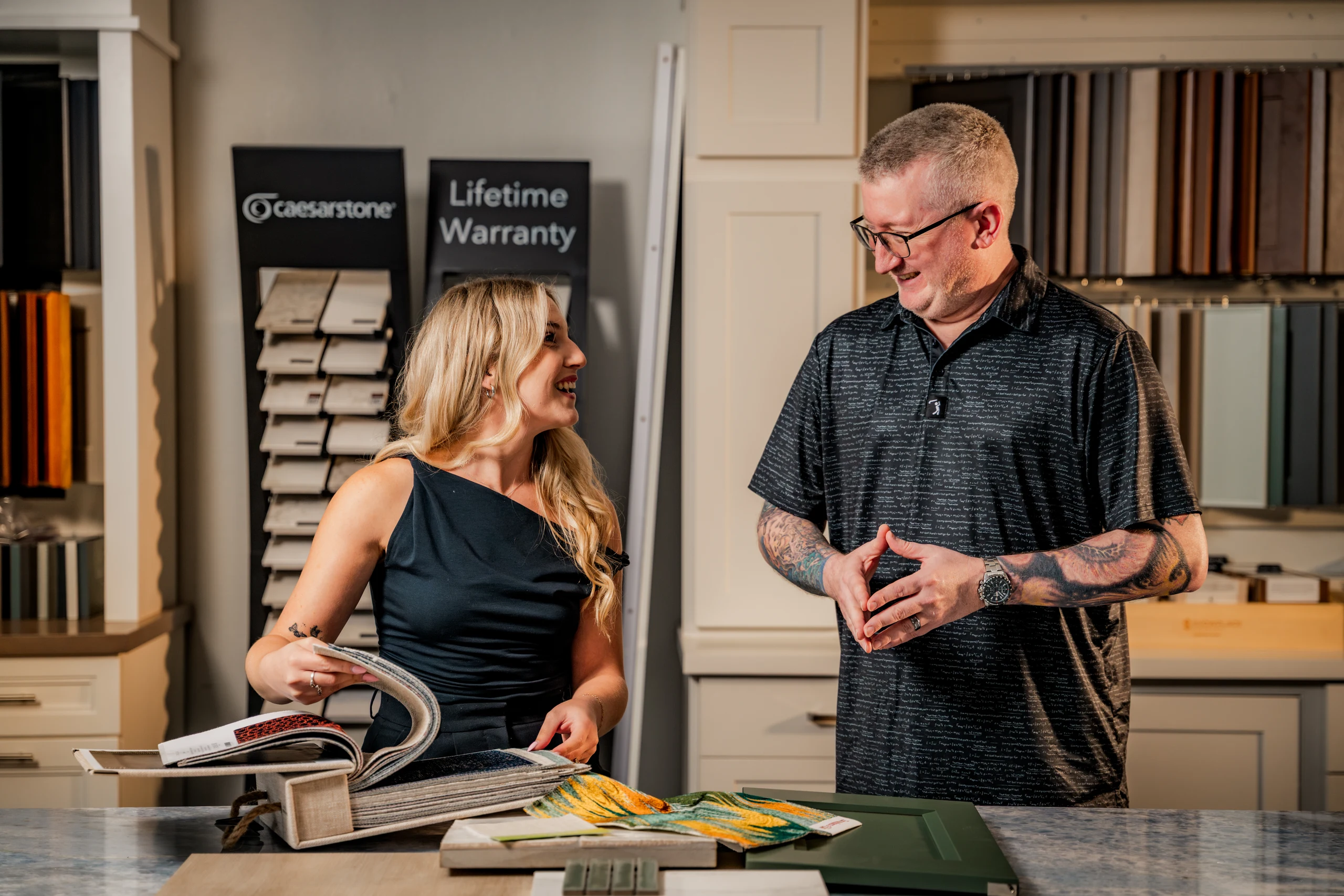 Grayhawk Remodeling designers reviewing material samples in the showroom