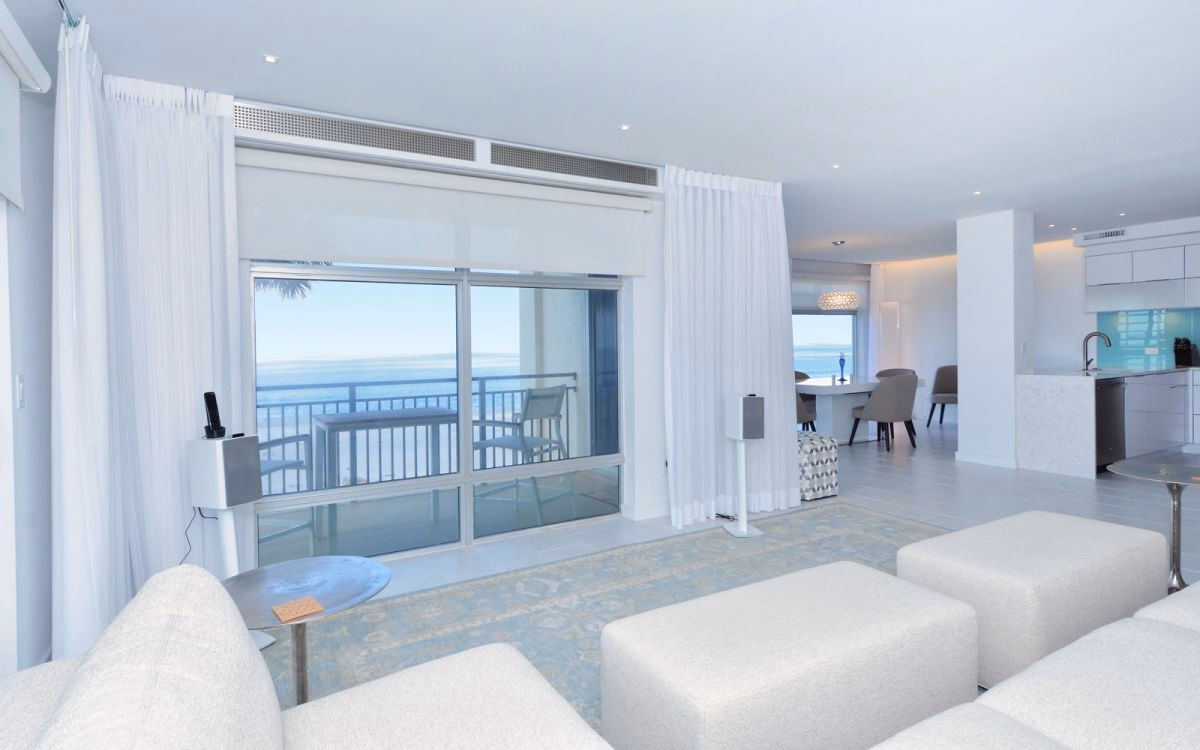 Gulf front living room with new sliding glass doors