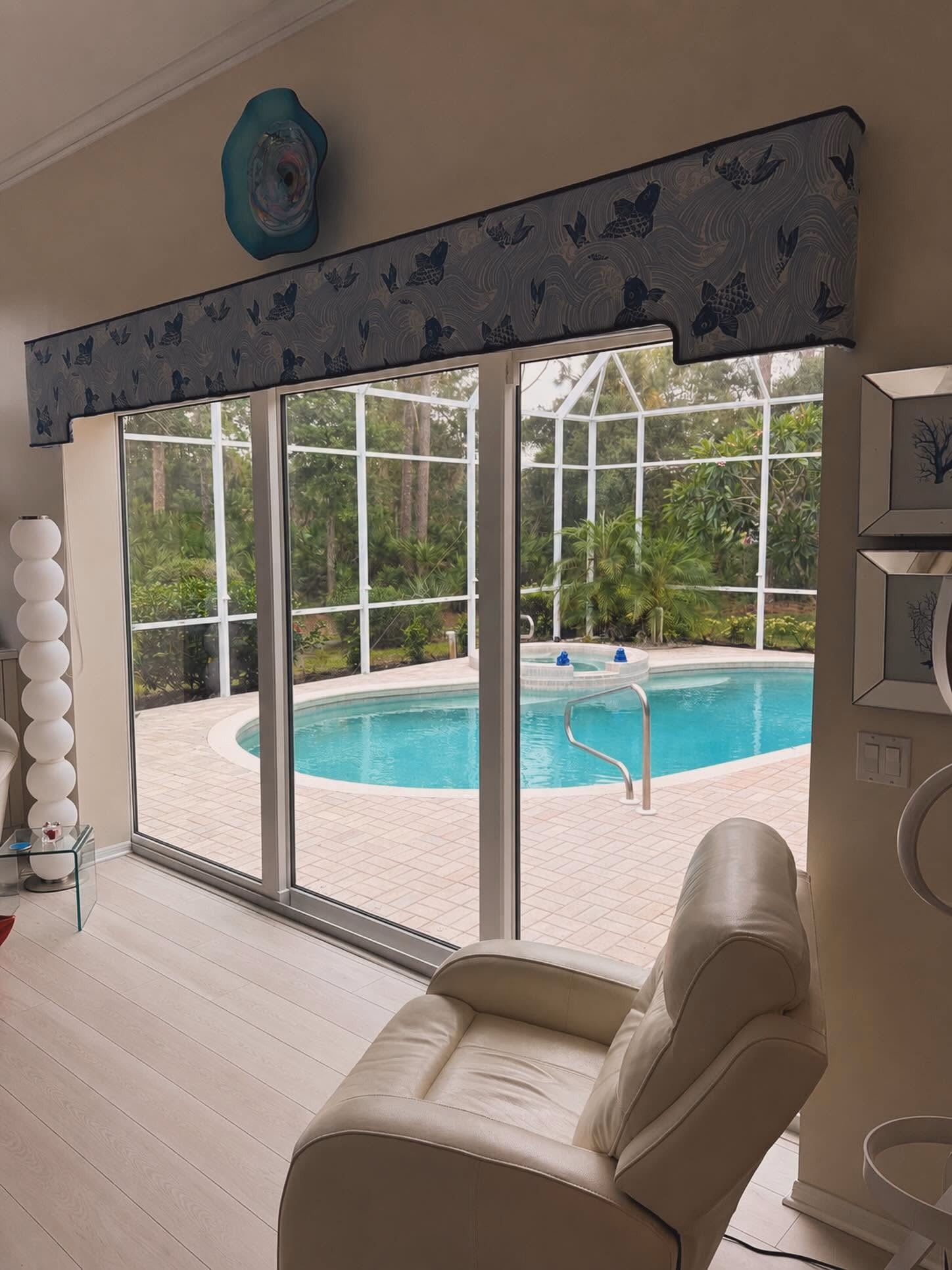 Replacement sliding glass doors opening to a screened pool deck