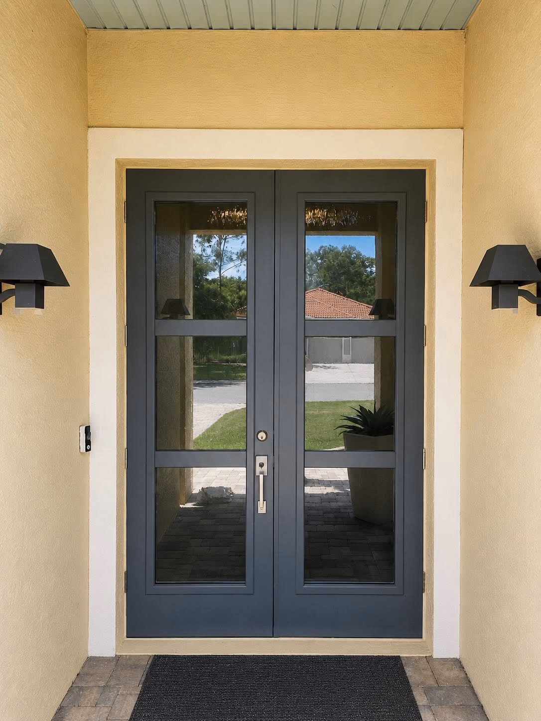 Charcoal impact rated double entry doors on a Florida home