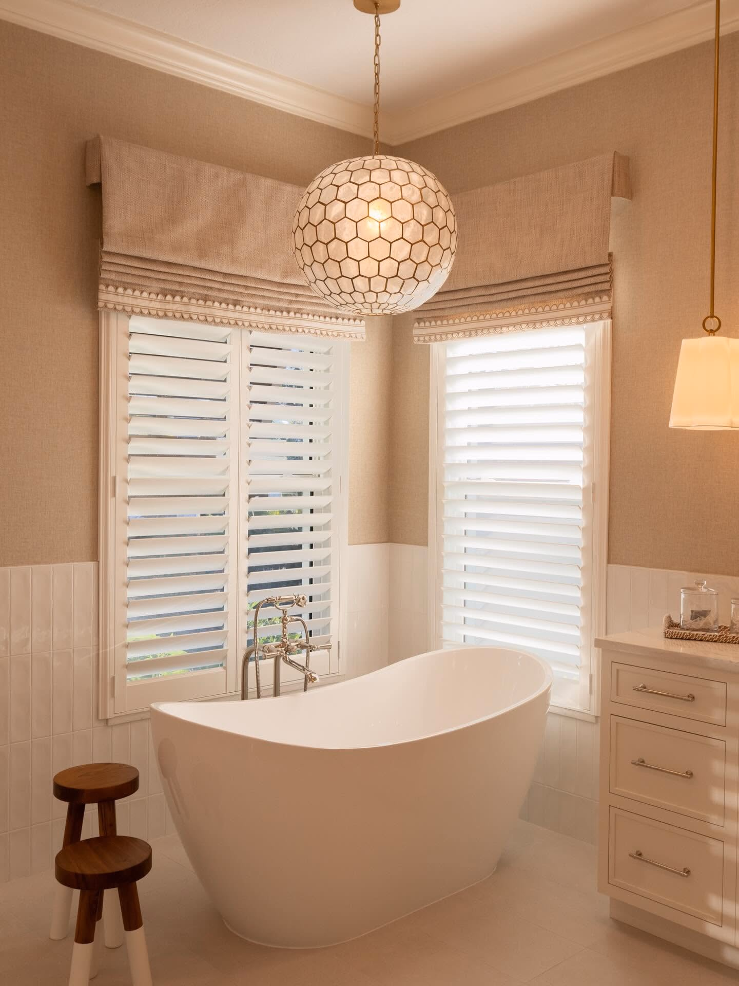Soaking tub with plantation shutters in a finished Grayhawk bath