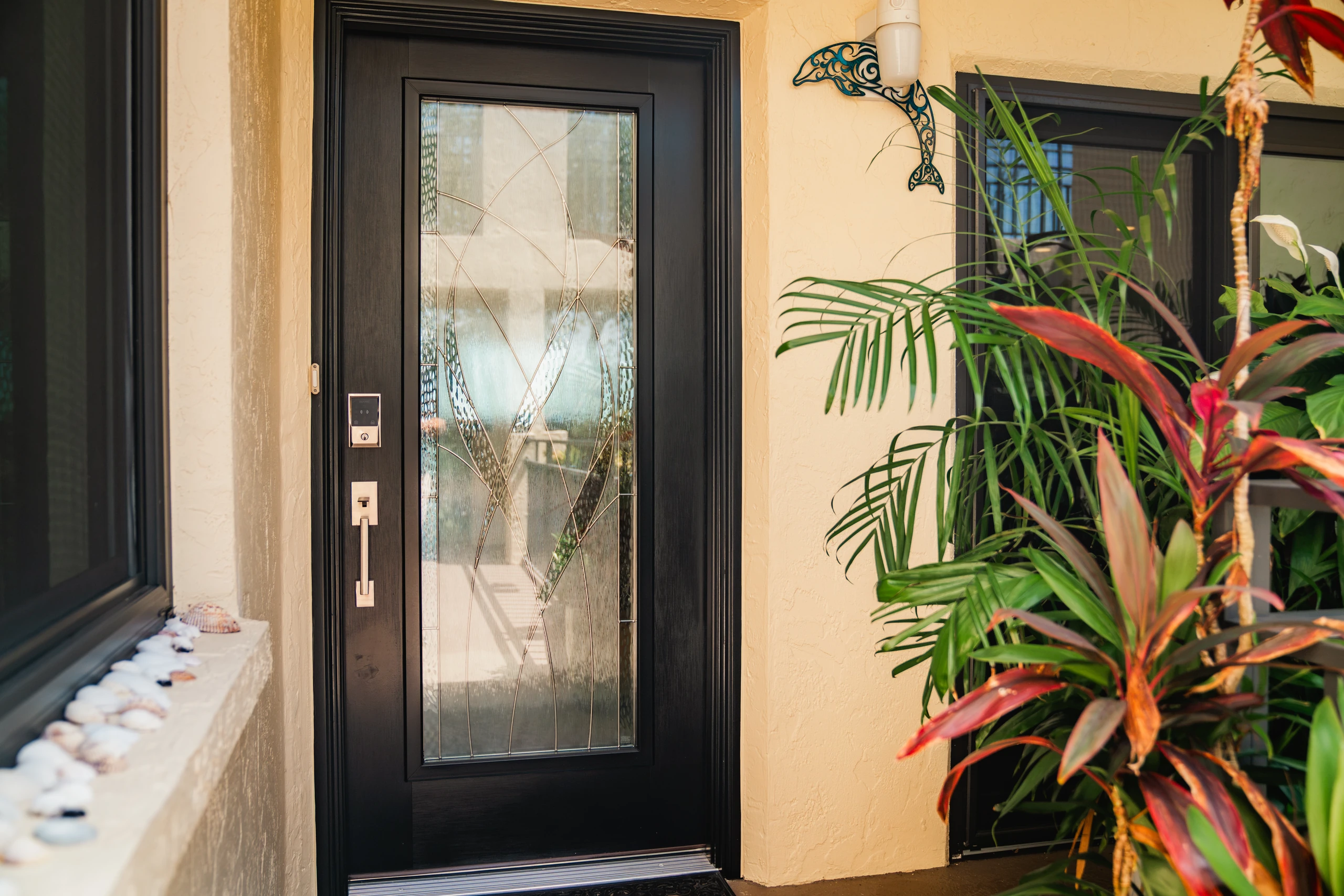 Black front entry door with decorative glass