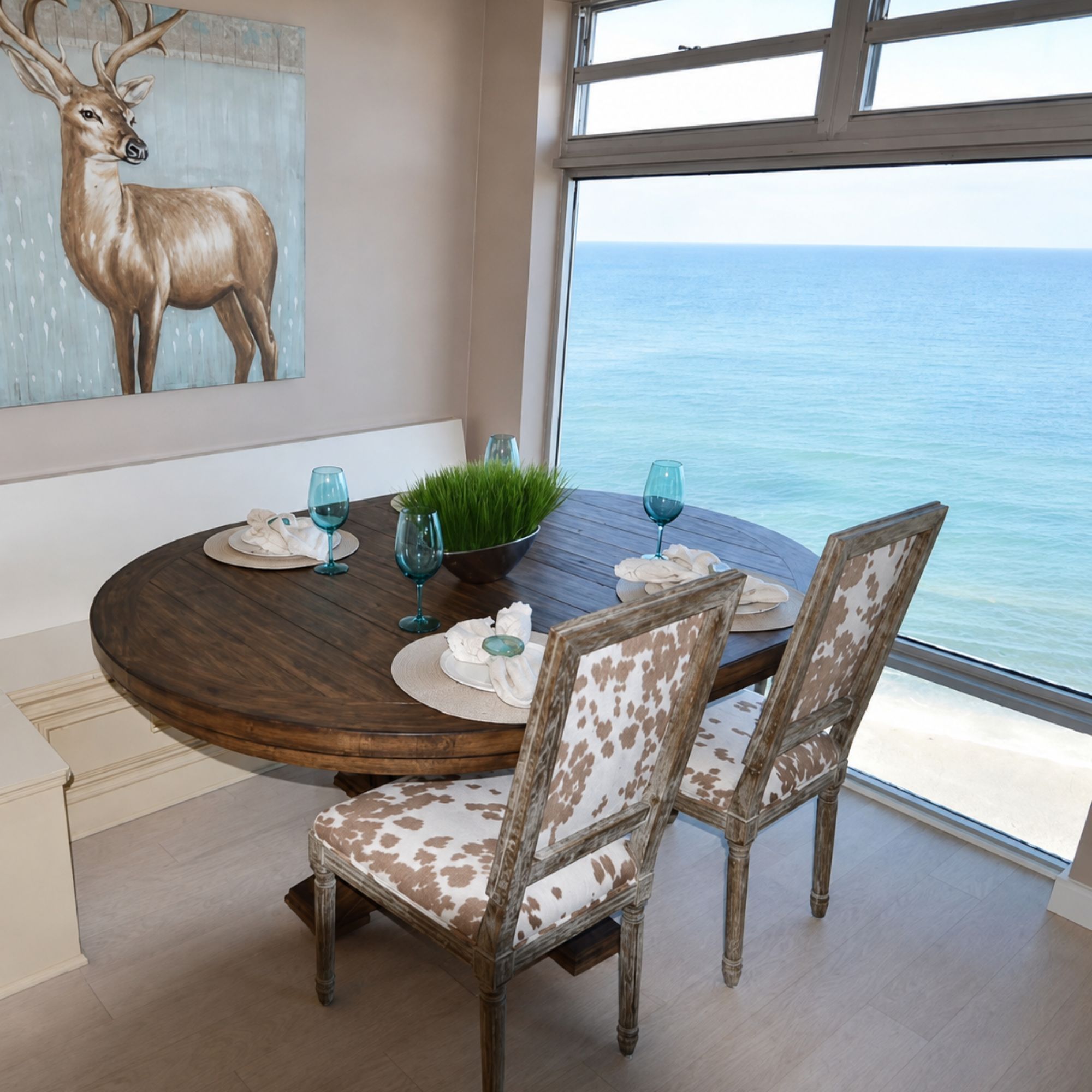 Breakfast nook with a corner window wall overlooking the Gulf