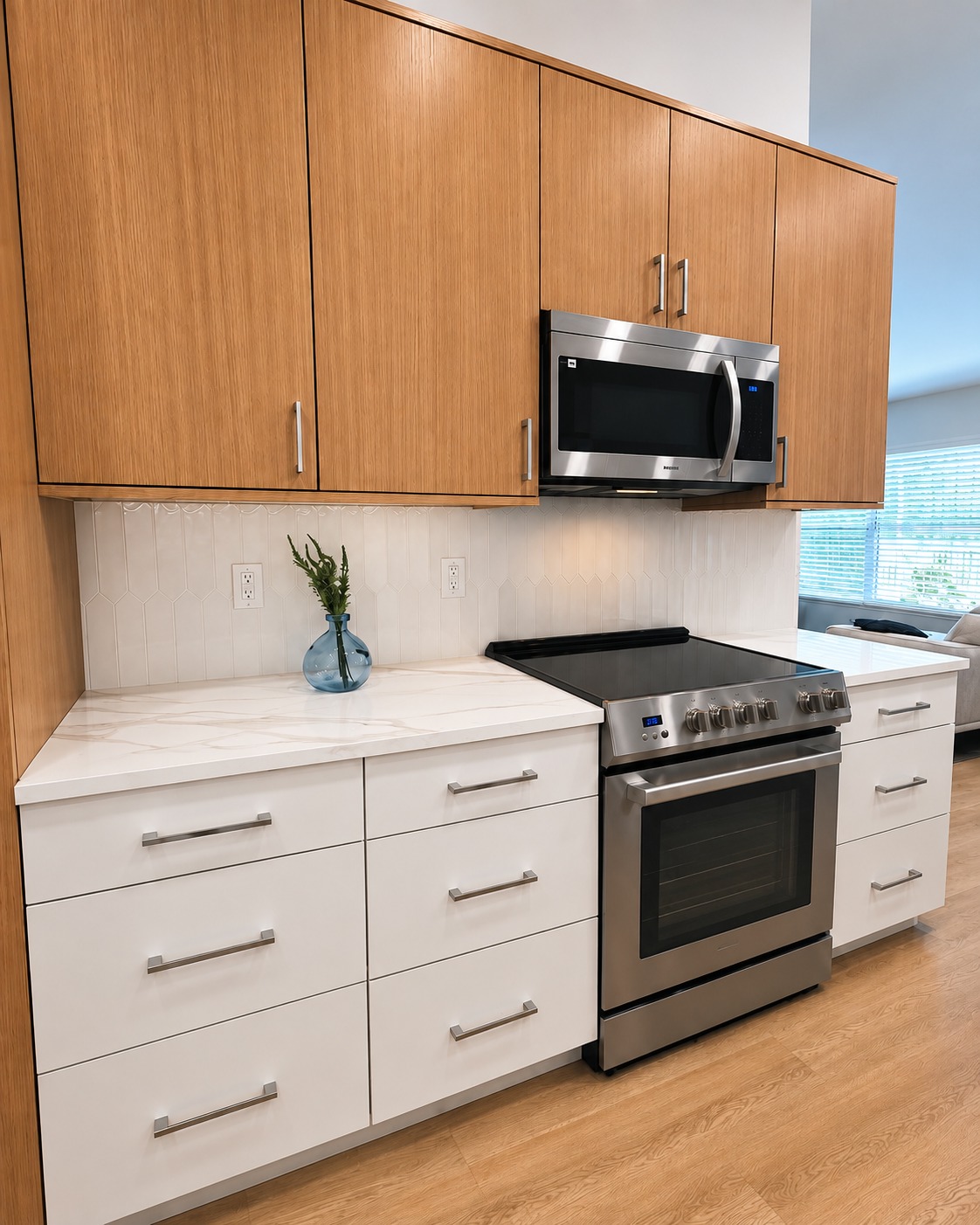 Kitchen with white and oak flat-panel cabinets and a stainless range