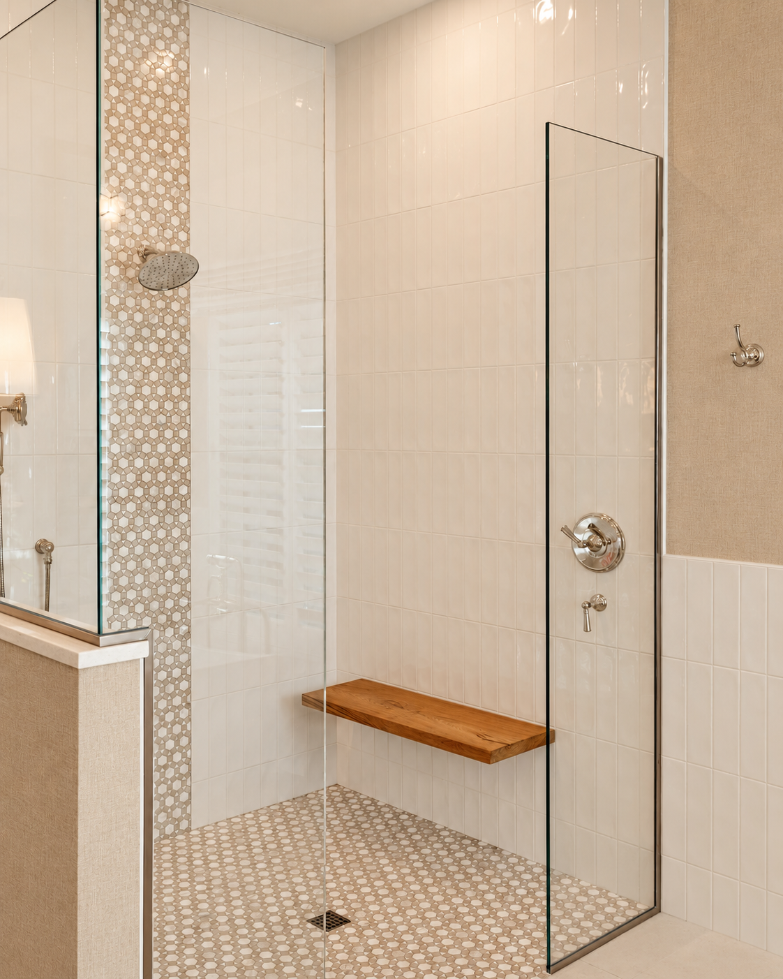 Walk-in shower with white tile, a teak bench and a penny-tile accent stripe
