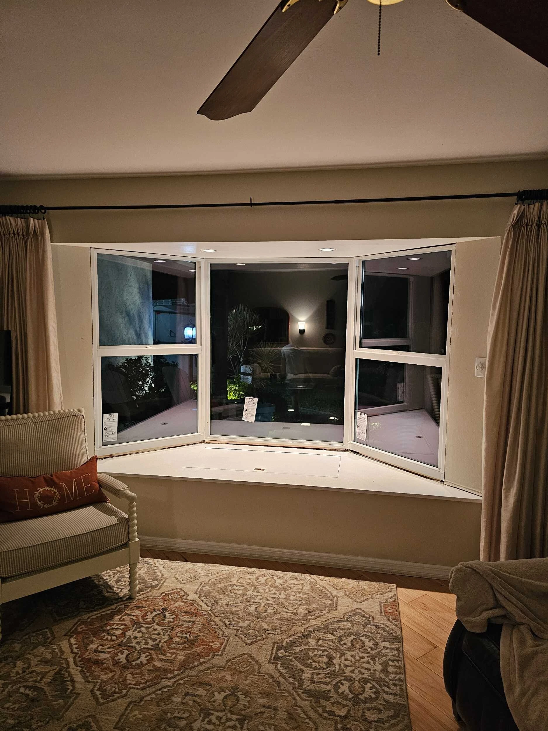 Bay window seat in a living room with new replacement windows