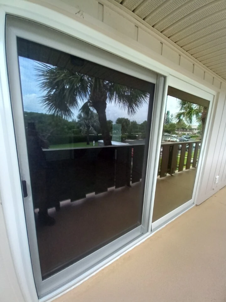 Large impact window and sliding door on a covered beachfront lanai