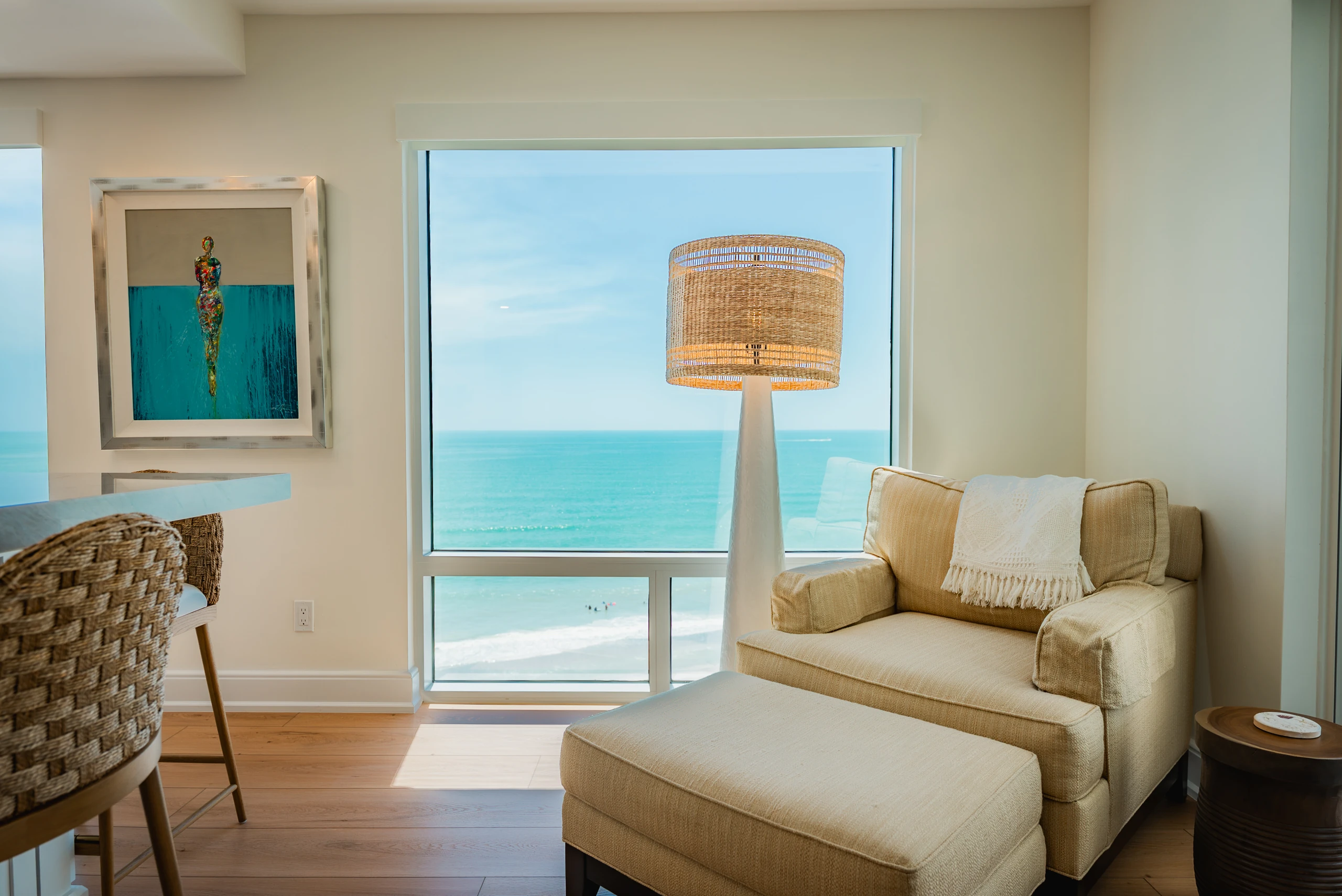 Living area with a large impact window overlooking the Gulf on Longboat Key