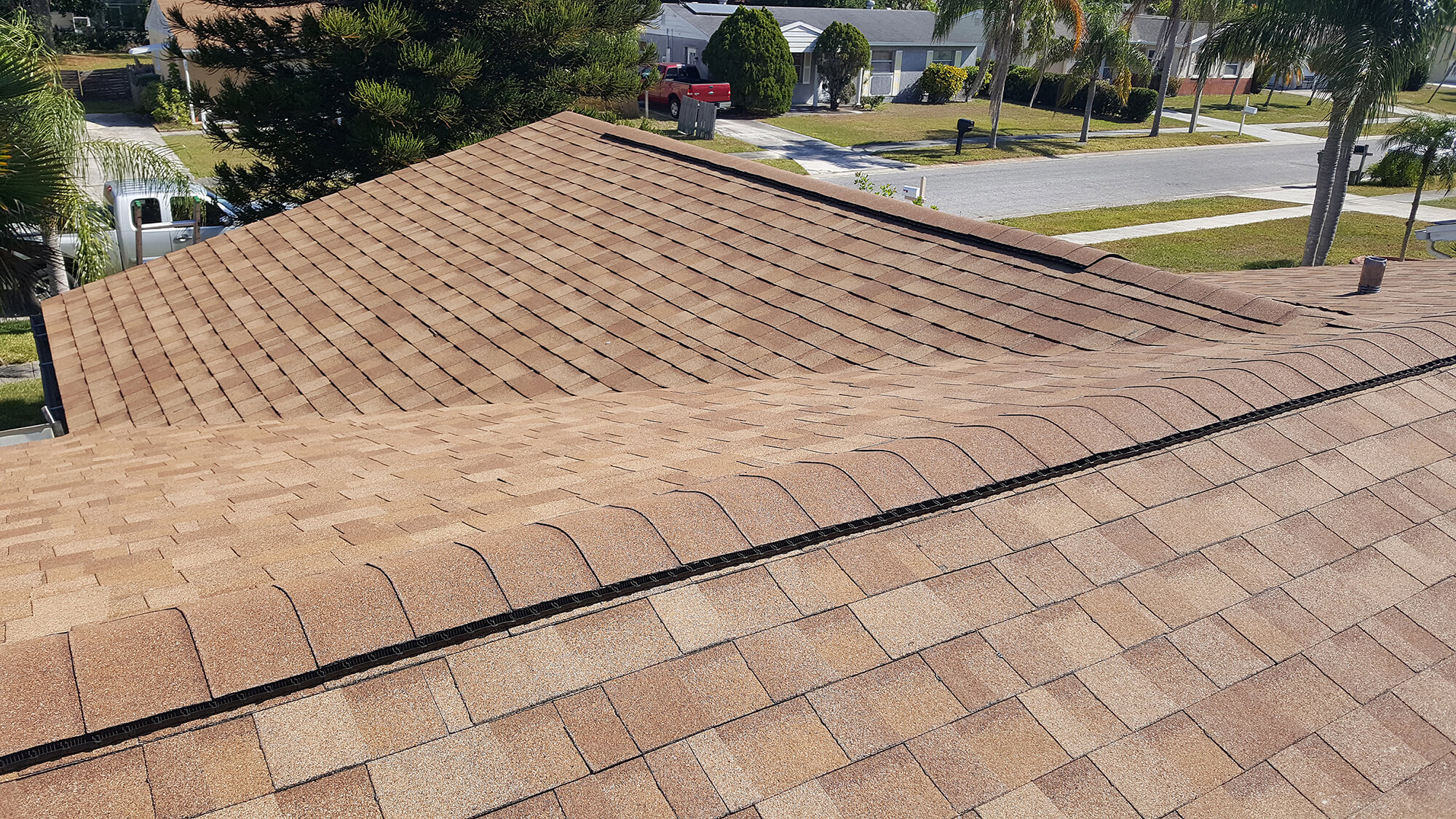 Architectural asphalt shingle roof overlooking a residential street