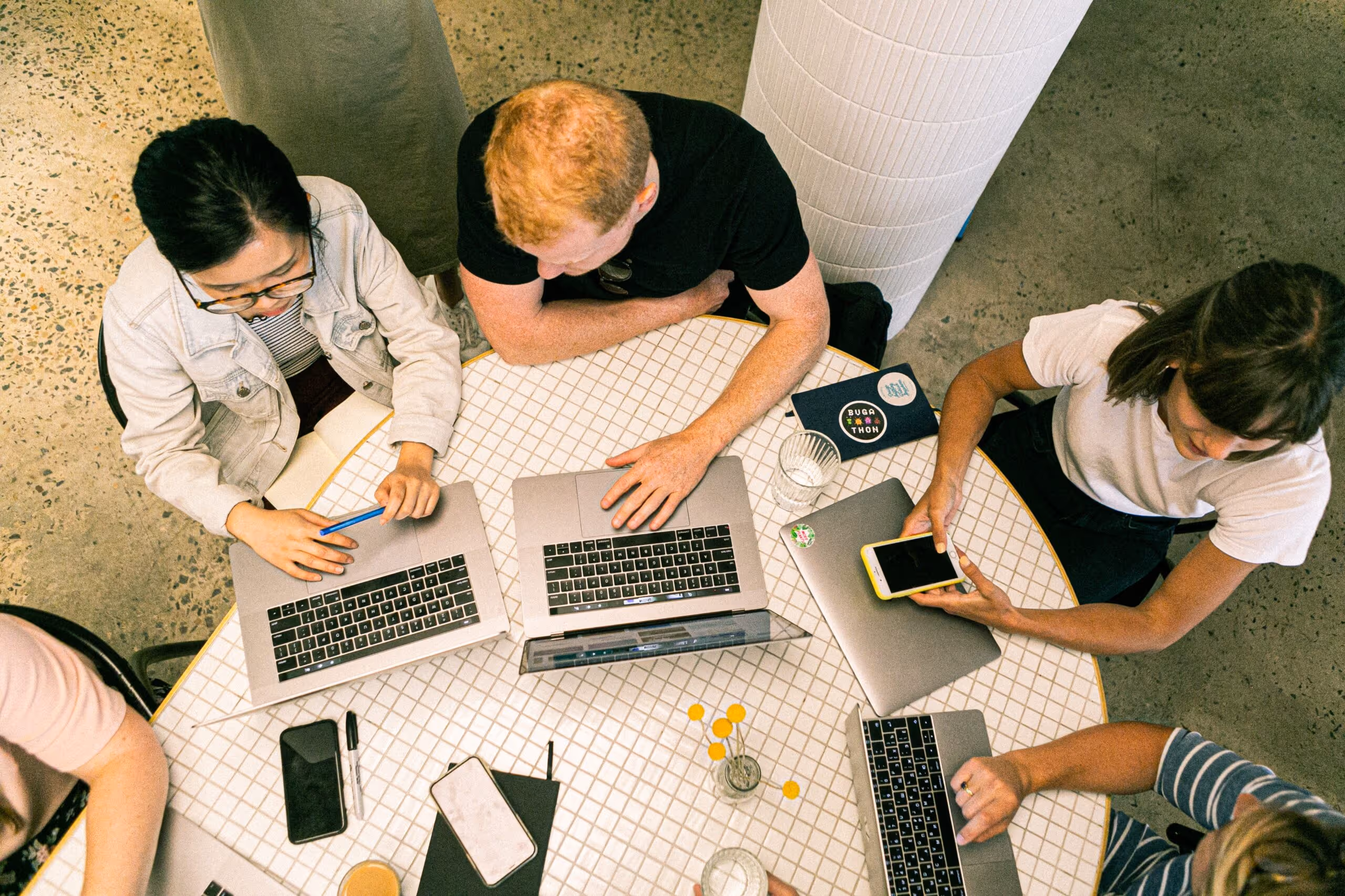 People in a meeting using laptops