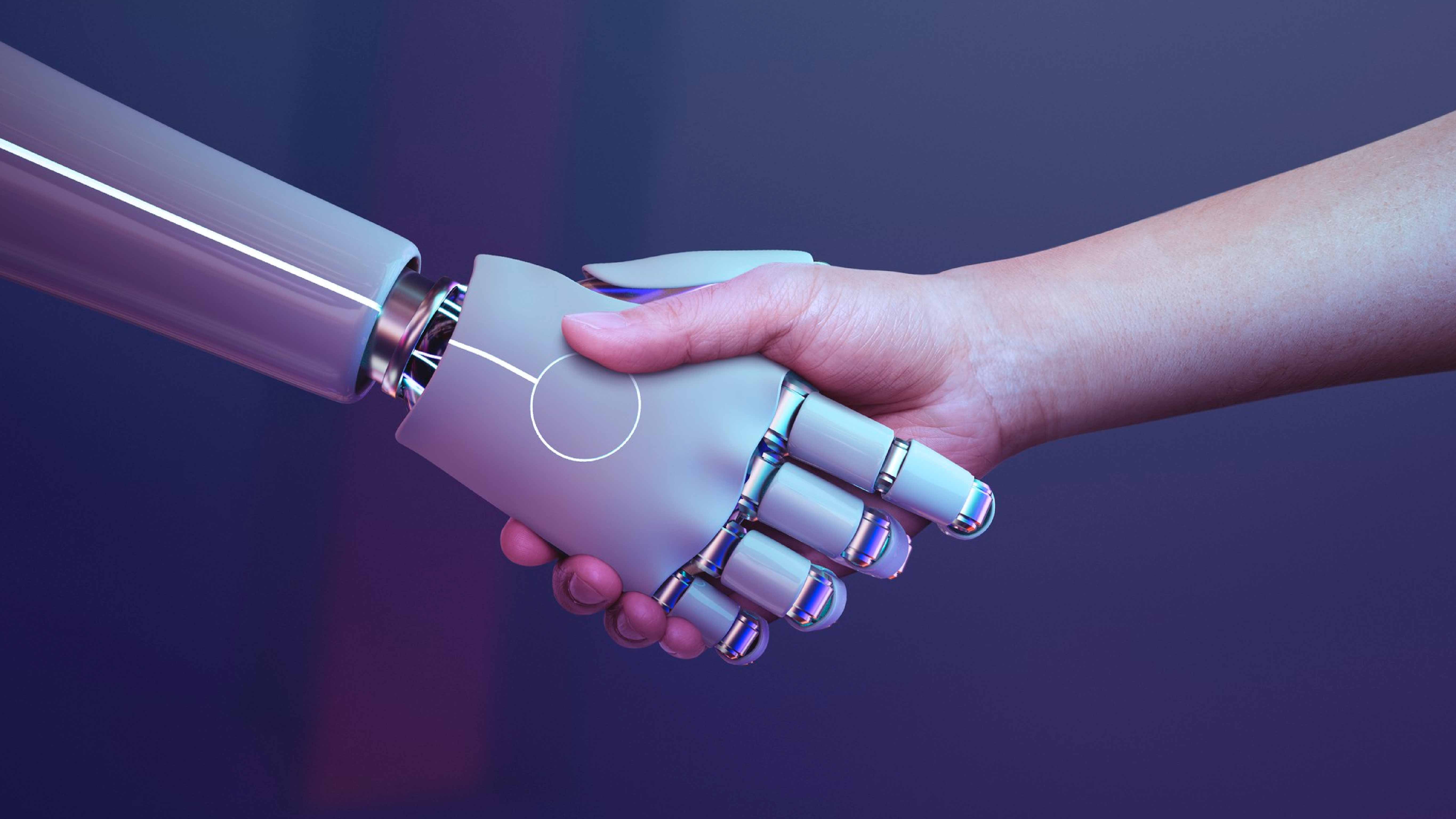 A human hand shaking hands with a robotic hand on a purple background.