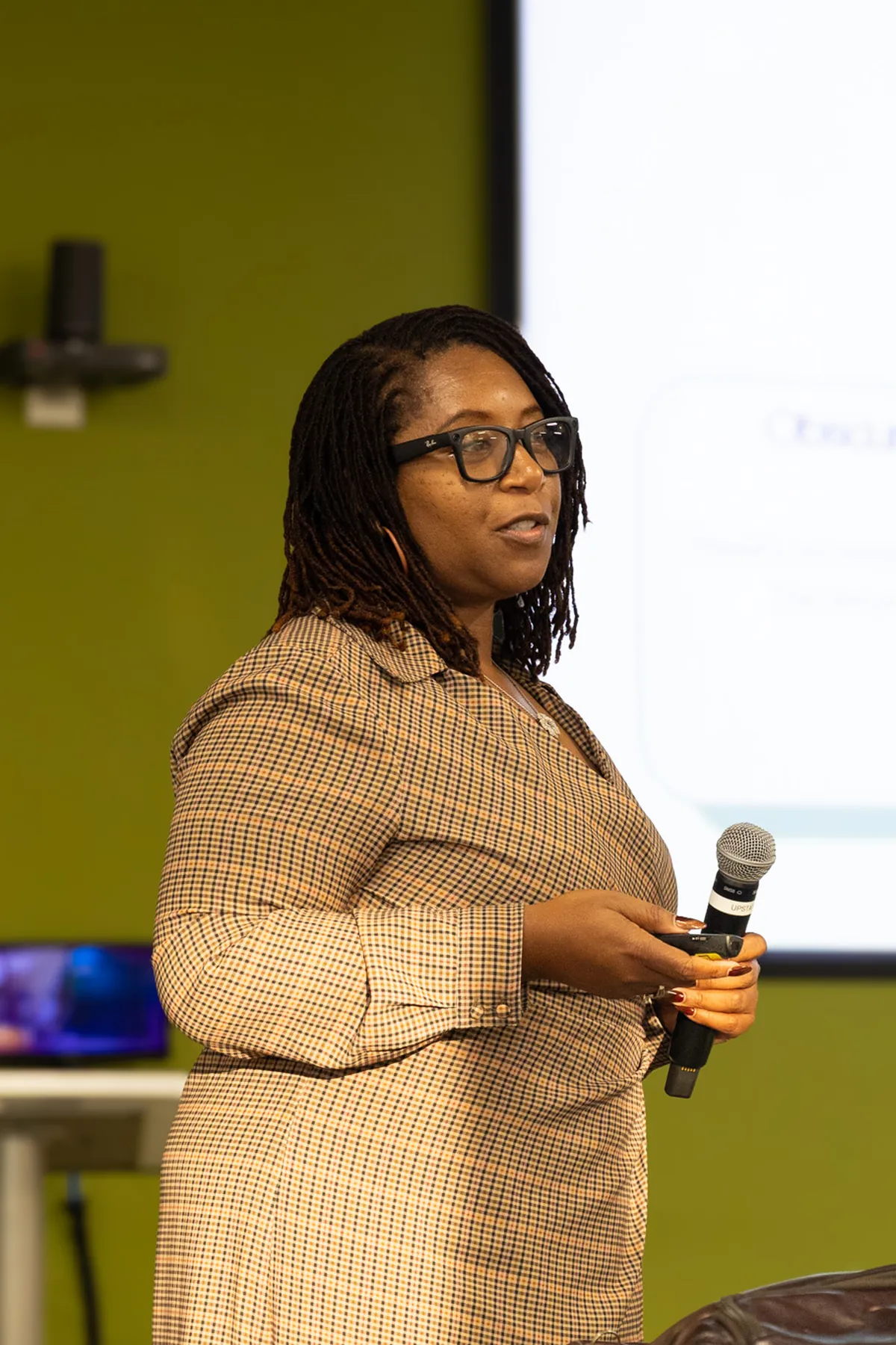 Founder presenting her company's current state at a Launchpad cohort session